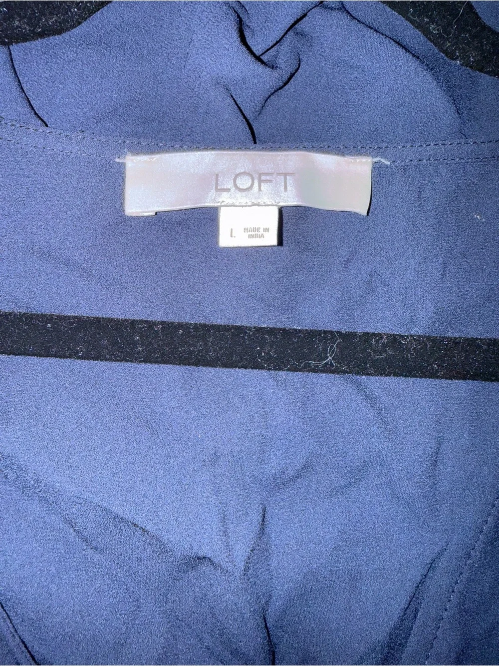 LOFT navy wrap top with flutter sleeves and side tie